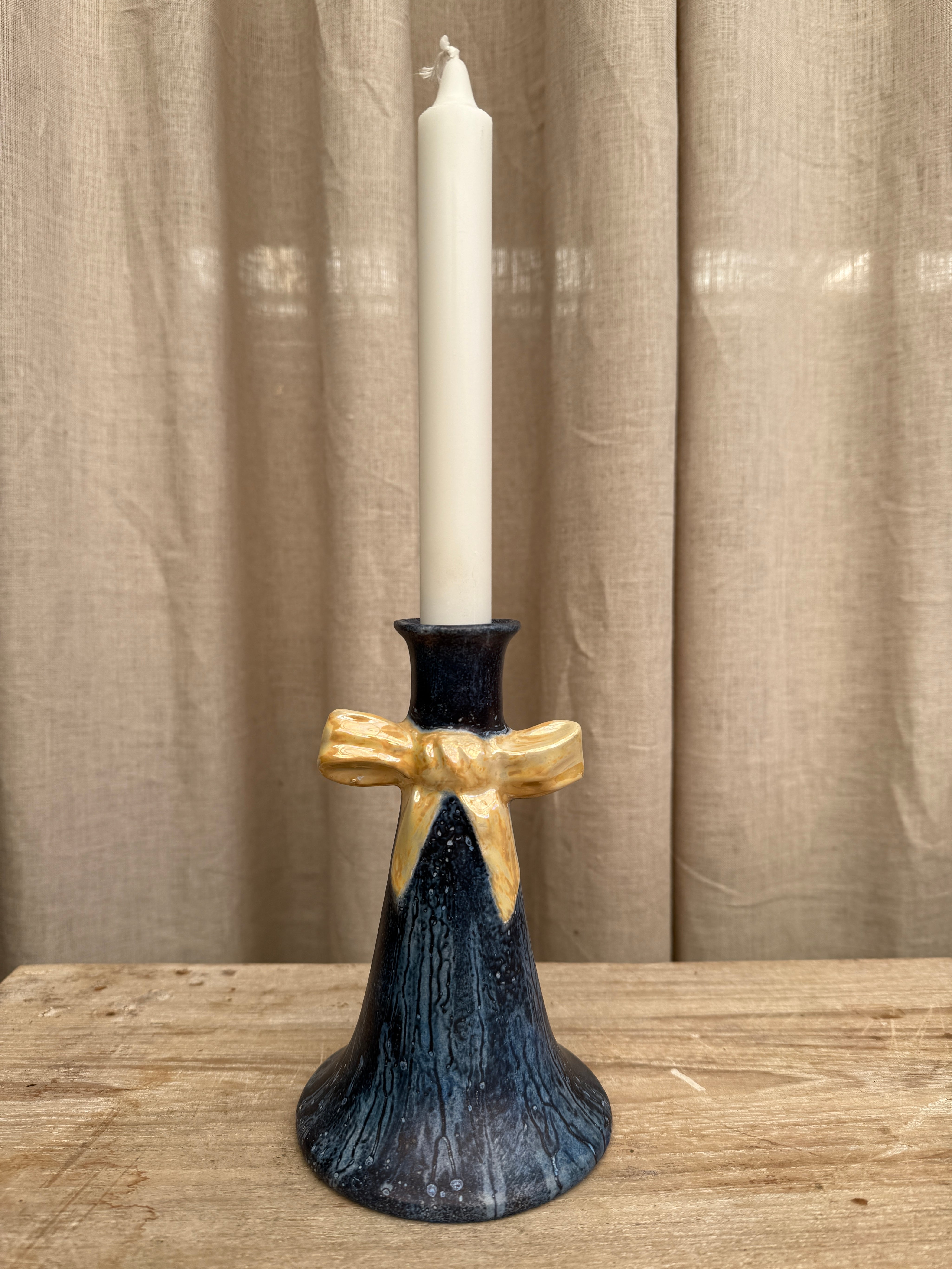 Ljusstake med rosett